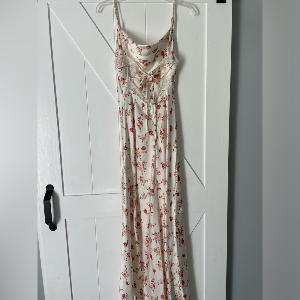 White satin dress w/ cowl neckline & pink flowers with a tie back & lace detail